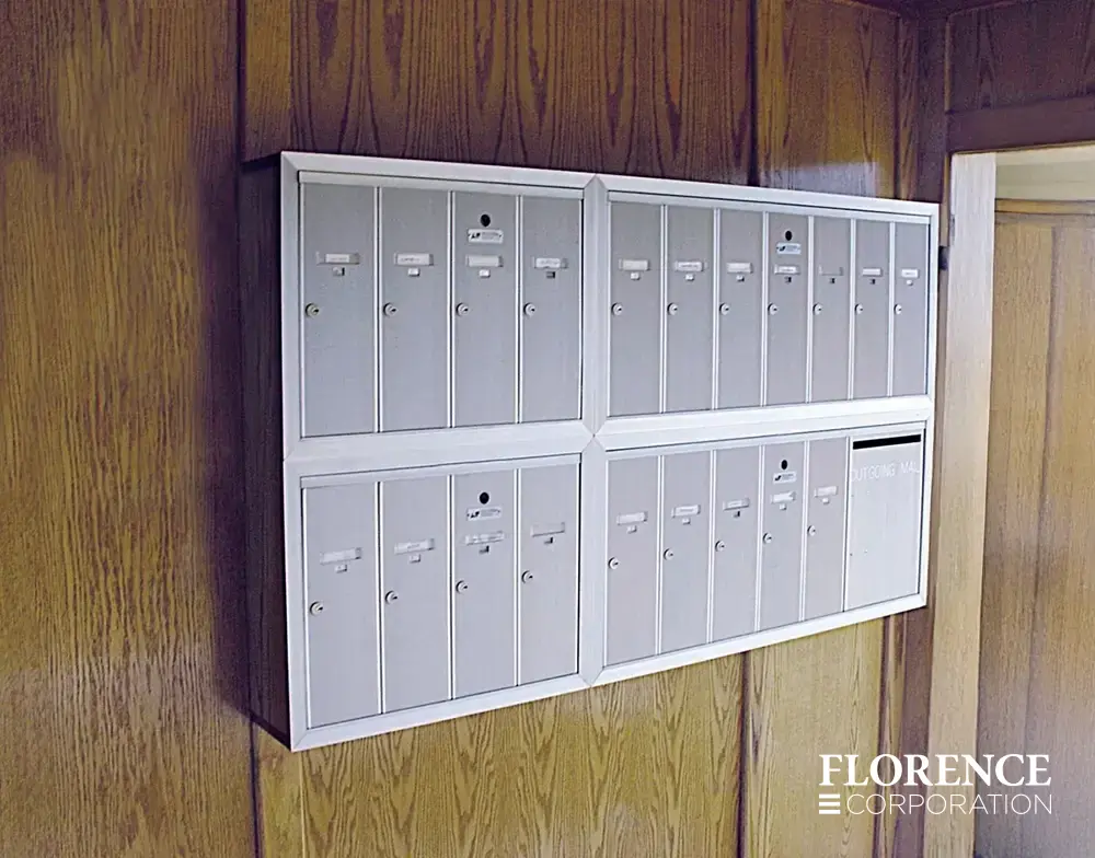 1250 surface mounted vertical 4B+ mailboxes in anodized aluminum installed indoor on wooden wall