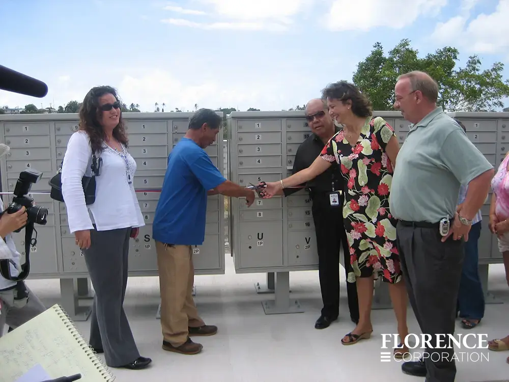 vital&trade; cluster box units in postal grey installation ribbon cutting with dealer and home owner association members