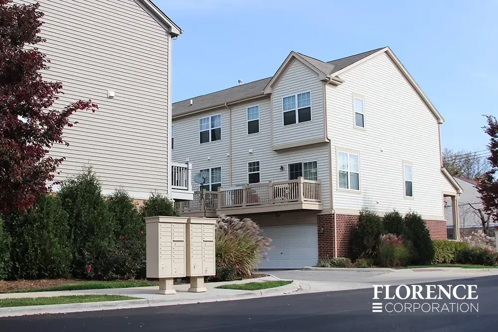 vogue&trade; accessories on vital&trade; cluster box units in sandstone installed in multifamily community