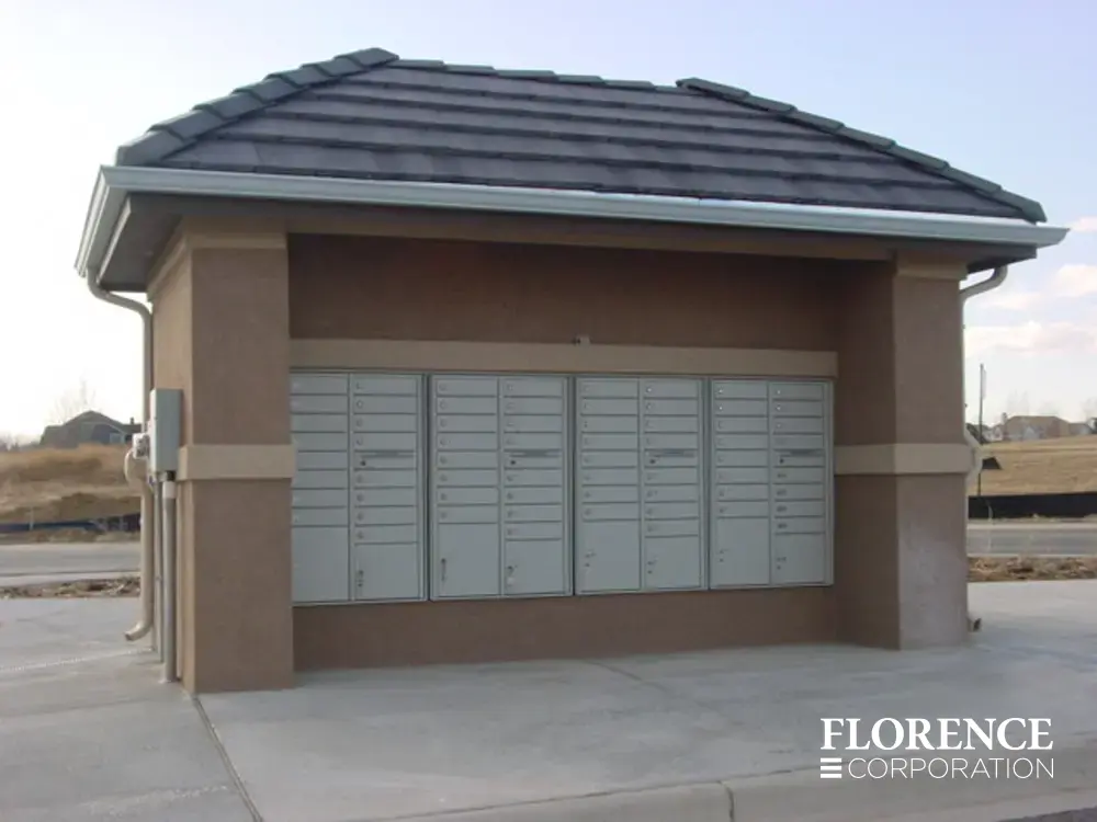 recessed mounted versatile&trade; 4C mailboxes in silver speck installed under covered fixture in new development lot