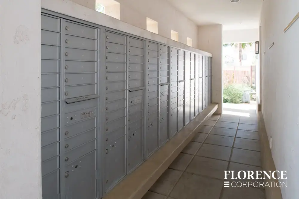 recessed mounted versatile&trade; 4C mailboxes in silver speck located in open air breezeway for multifamily pool area