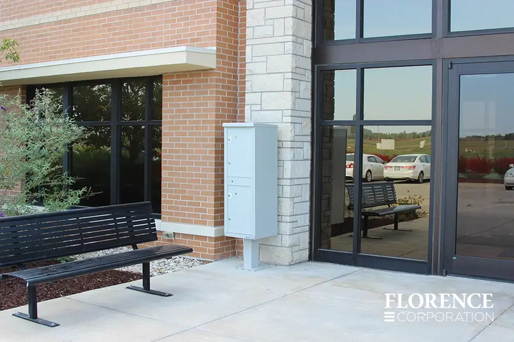 valiant-1590-OPL-series_010 valiant™ outdoor parcel locker in postal grey installed outdoor near entrance of commercial brick building