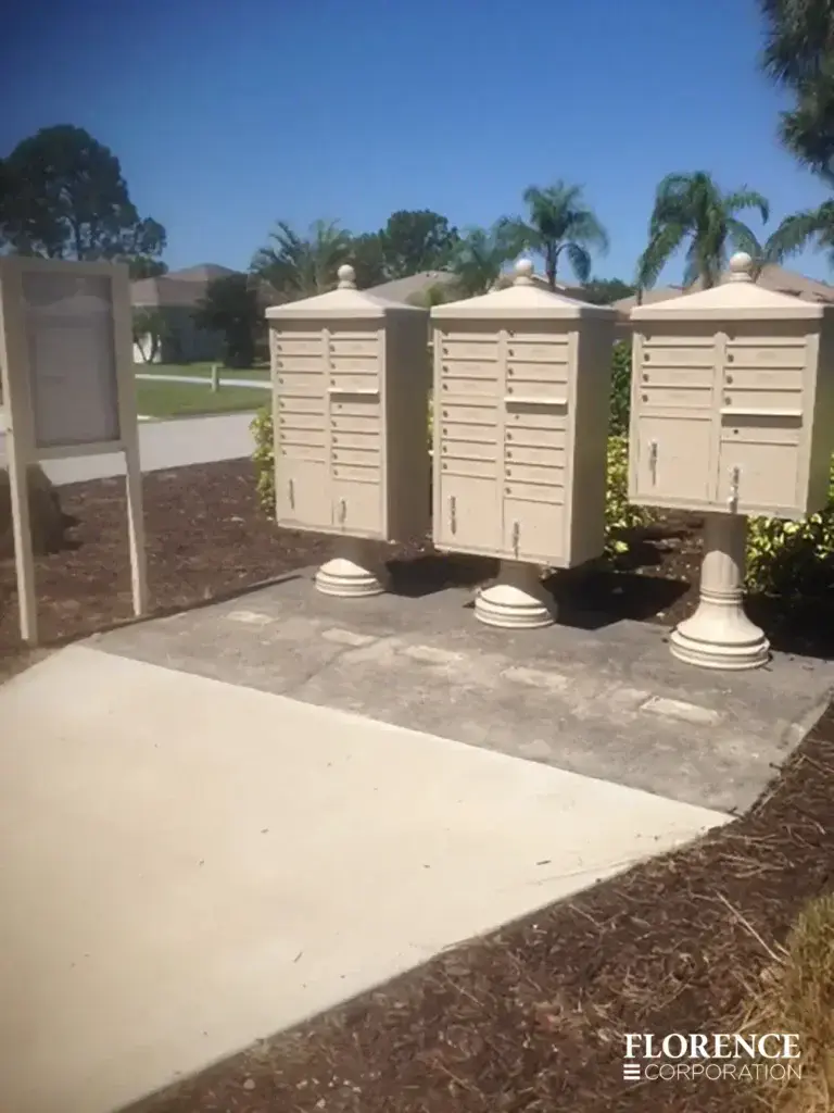 vogue-CBU-Accessories_008 vogue™ accessories on vital™ cluster box units all in sandstone installed on concrete slab outdoors on a sunny bright day with blue sky and palm trees in background