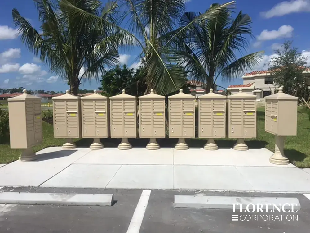 vogue-CBU-Accessories_011 vogue™ accessories on vital™ cluster box units all in sandstone grouped together near the sidewalk of a parking lot in a sunny neighborhood with blue skies and palm trees in the background