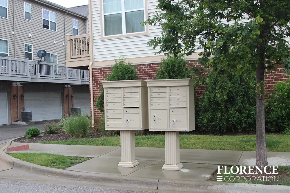vogue-CBU-Accessories_012 vogue™ accessories on vital™ cluster box units in sandstone installed near curb of multifamily townhome development on a rainy day
