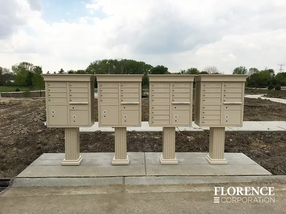 vogue-CBU-Accessories_013 vogue™ accessories on vital™ cluster box units in sandstone installed on concrete slab in developing single-family neighborhood in early development stages