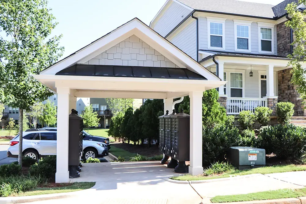 vogue-CBU-Accessories_025 vogue™ accessories on vital™ cluster box units in dark bronze installed in town home community with covered awning to protect residents from the weather