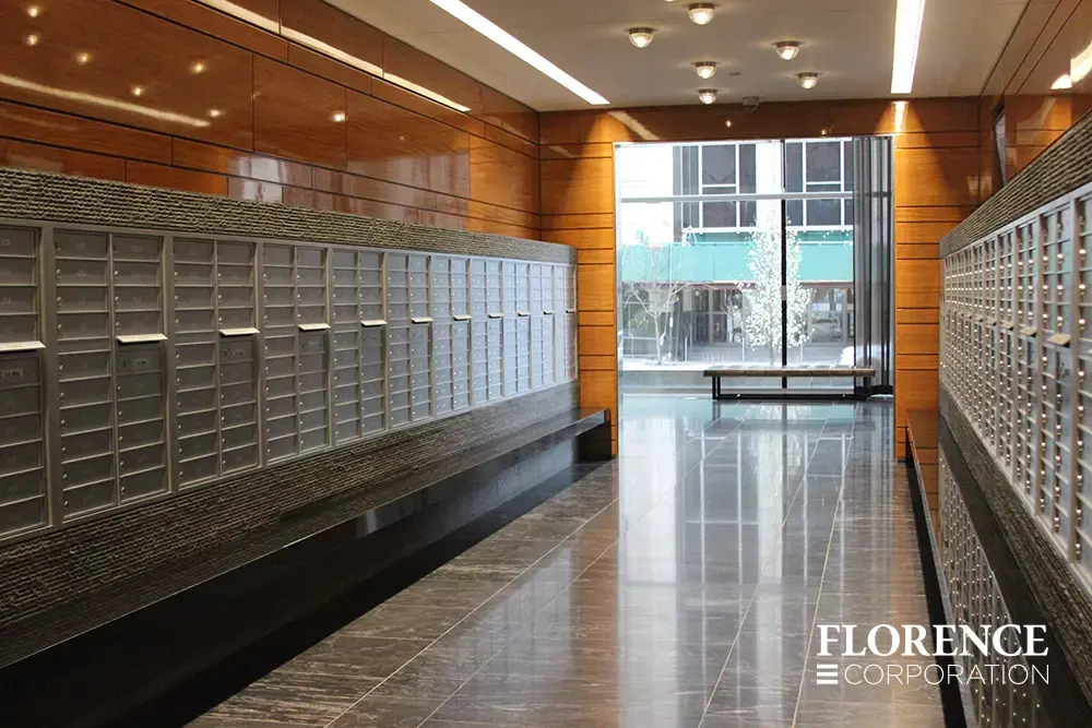 versatile-4C-indoor-install_008 Recessed mount versatile™ 4C mailboxes in silver speck installed inside modern apartment lobby area