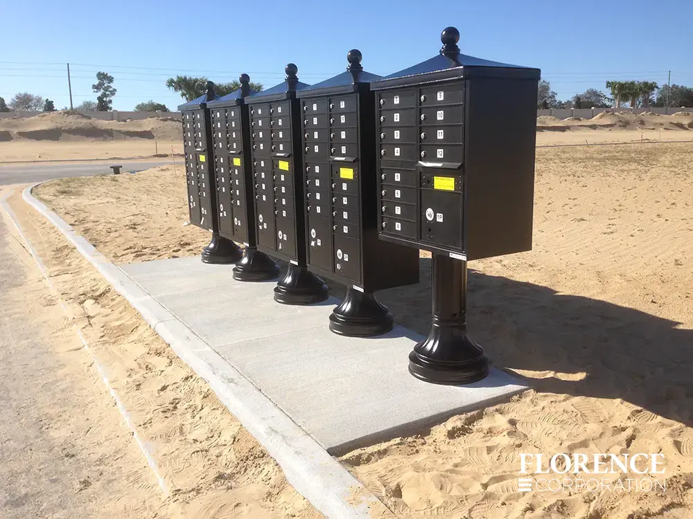 vogue-CBU-Accessories_003 vogue™ accessories on vital™ cluster box units in black installed on concrete slab in brand-new single-family neighborhood under development