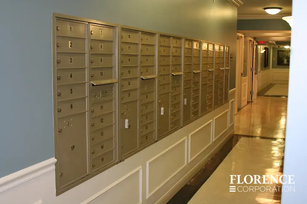 versatile-4C-indoor-install_029 Recessed mount versatile™ 4C mailboxes in silver speck installed indoor in dark multifamily apartment building first floor hallway