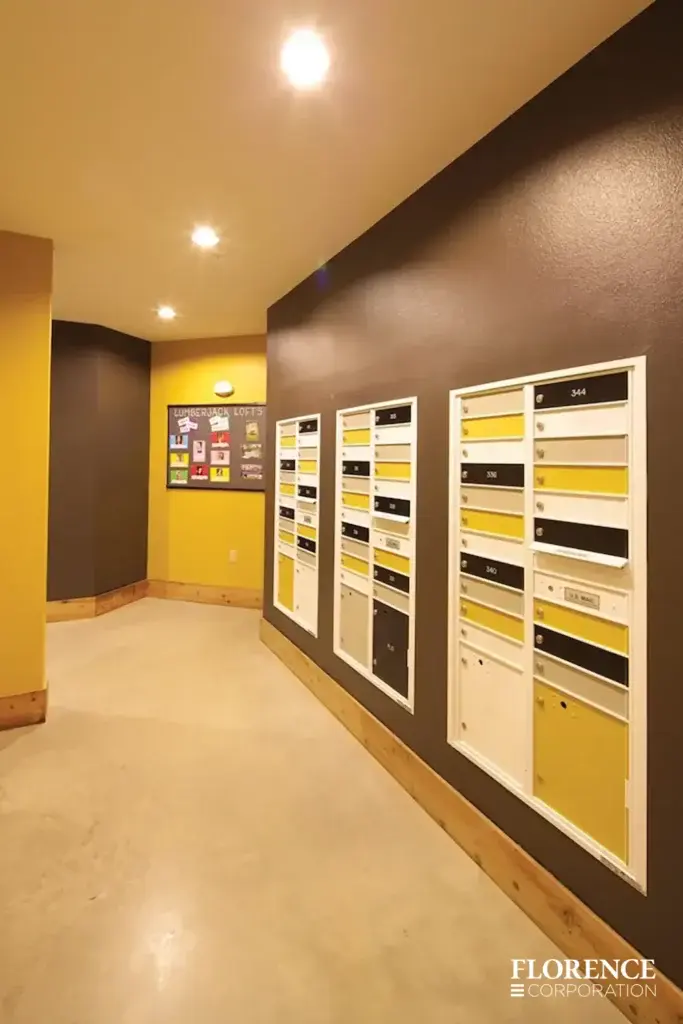 versatile-4C-indoor-install_031 Recessed mount versatile™ 4C mailboxes with multiple colored compartment doors installed in residential hallway with brown and yellow walls