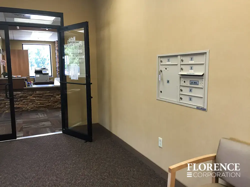 versatile-4C-indoor-install_039 Recessed mount versatile™ 4C mailboxes in sandstone installed on cream wall of commercial building
