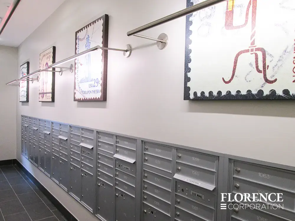 versatile-4C-indoor-install_041 Recessed mount versatile™ 4C mailboxes in silver speck mounted in white wall with modern lit artwork