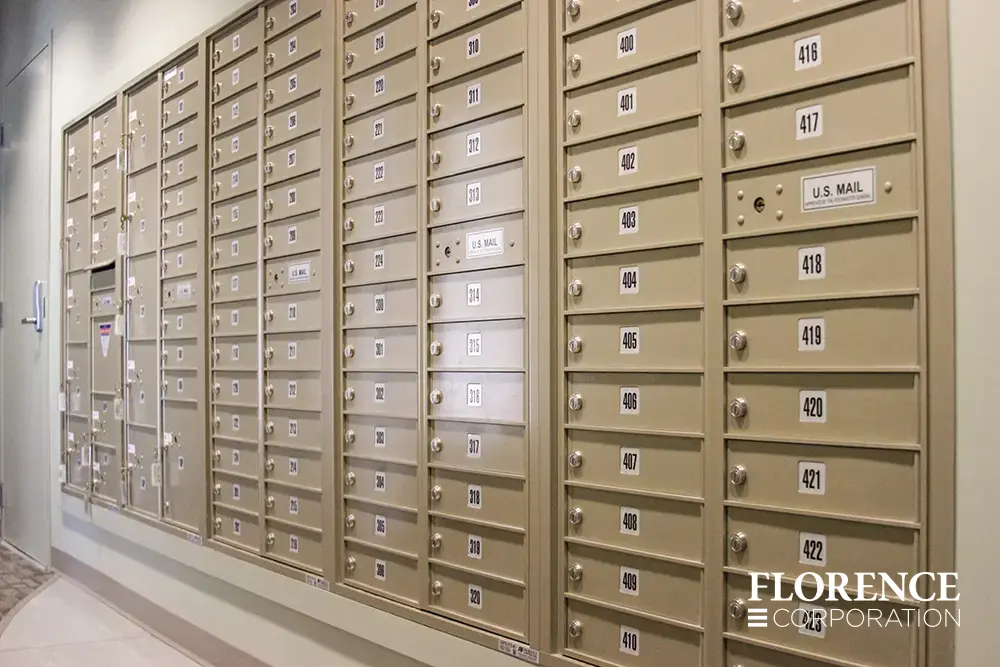 versatile-4C-indoor-install_042 Recessed mount versatile™ 4C mailboxes in sandstone installed in wall in multifamily apartment building