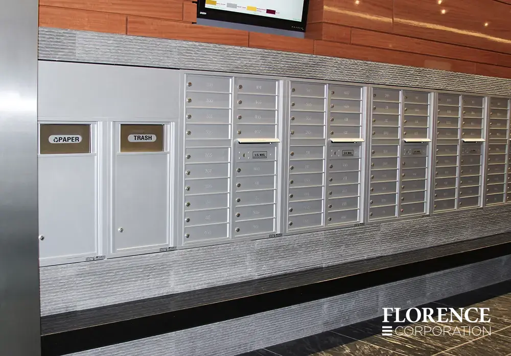versatile-4C-indoor-install_043 Recessed mount versatile™ 4C mailboxes and bins in silver speck installed in commercial building space trimmed with gray stone over black ledge