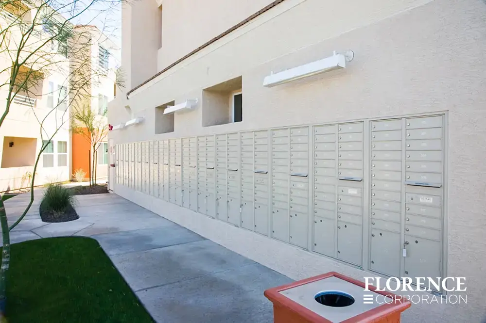 versatile-4C-recessed-indoor-08 recessed mounted versatile™ 4C mailboxes in silver speck installed outdoors on exterior of multifamily apartment building