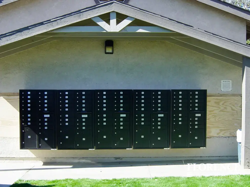 4C-versatile-surface-depot_008 multiple surface mounted versatile™ 4C mailboxes in black mounted outdoor on side of community building