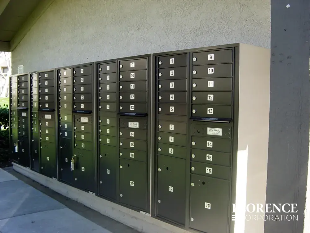 4C-versatile-surface-depot_009 versatile™ 4C mailboxes in black mounted outdoor on side of building under weather protected cover using sandstone surface mount collars