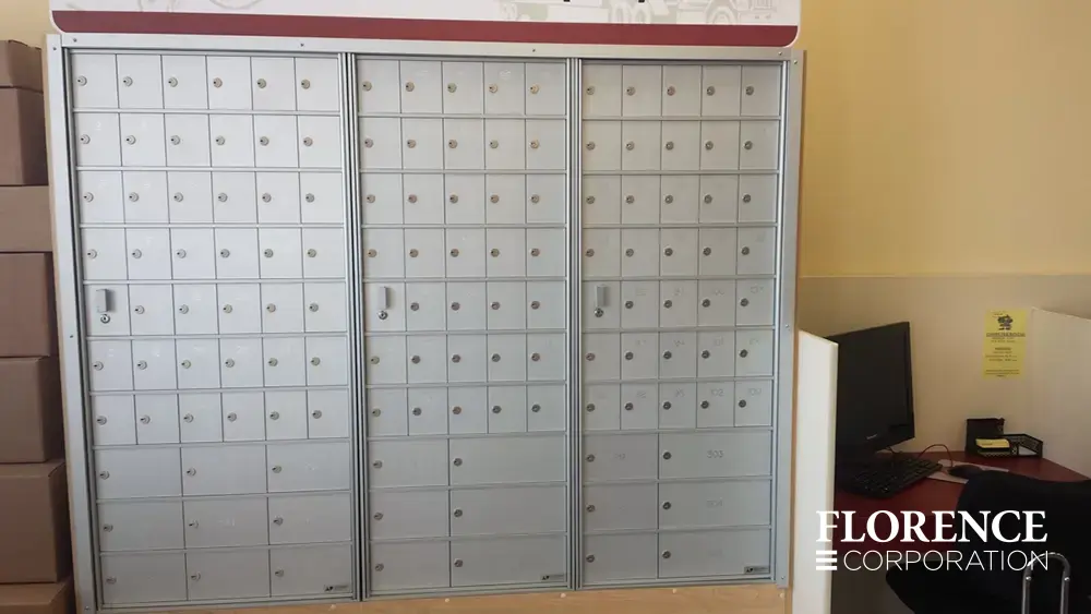 1600 Series 4B+ horizontal mailboxes in anodized aluminum installed recessed in white wall of commercial building space